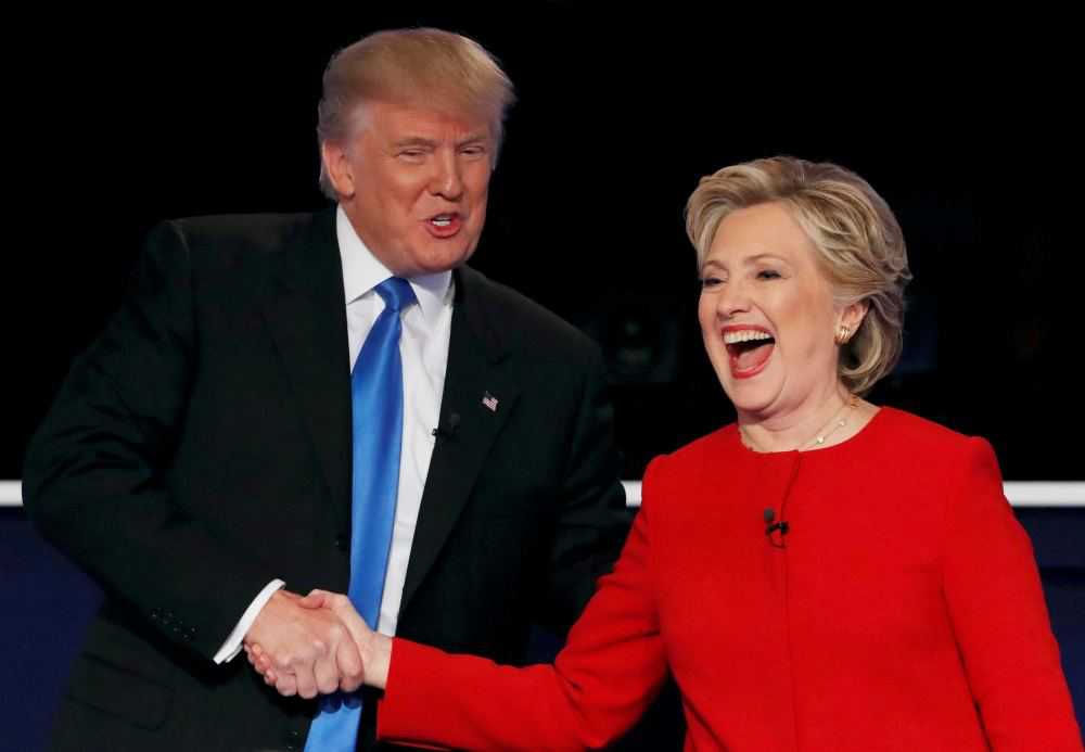 Republican U.S. presidential nominee Donald Trump shakes hands with Democratic U.S. presidential nominee Hillary Clinton at the conclusion of their first presidential debate at Hofstra University in Hempstead, New York, U.S., September 26, 2016. REUTERS/Mike Segar/File Photo
